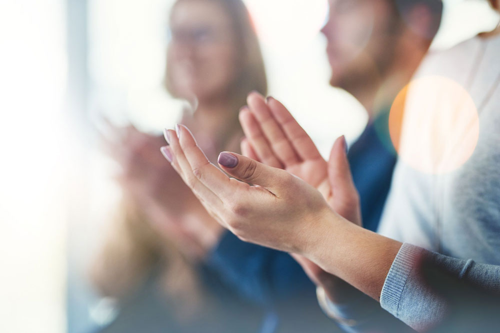 close up of hands clapping